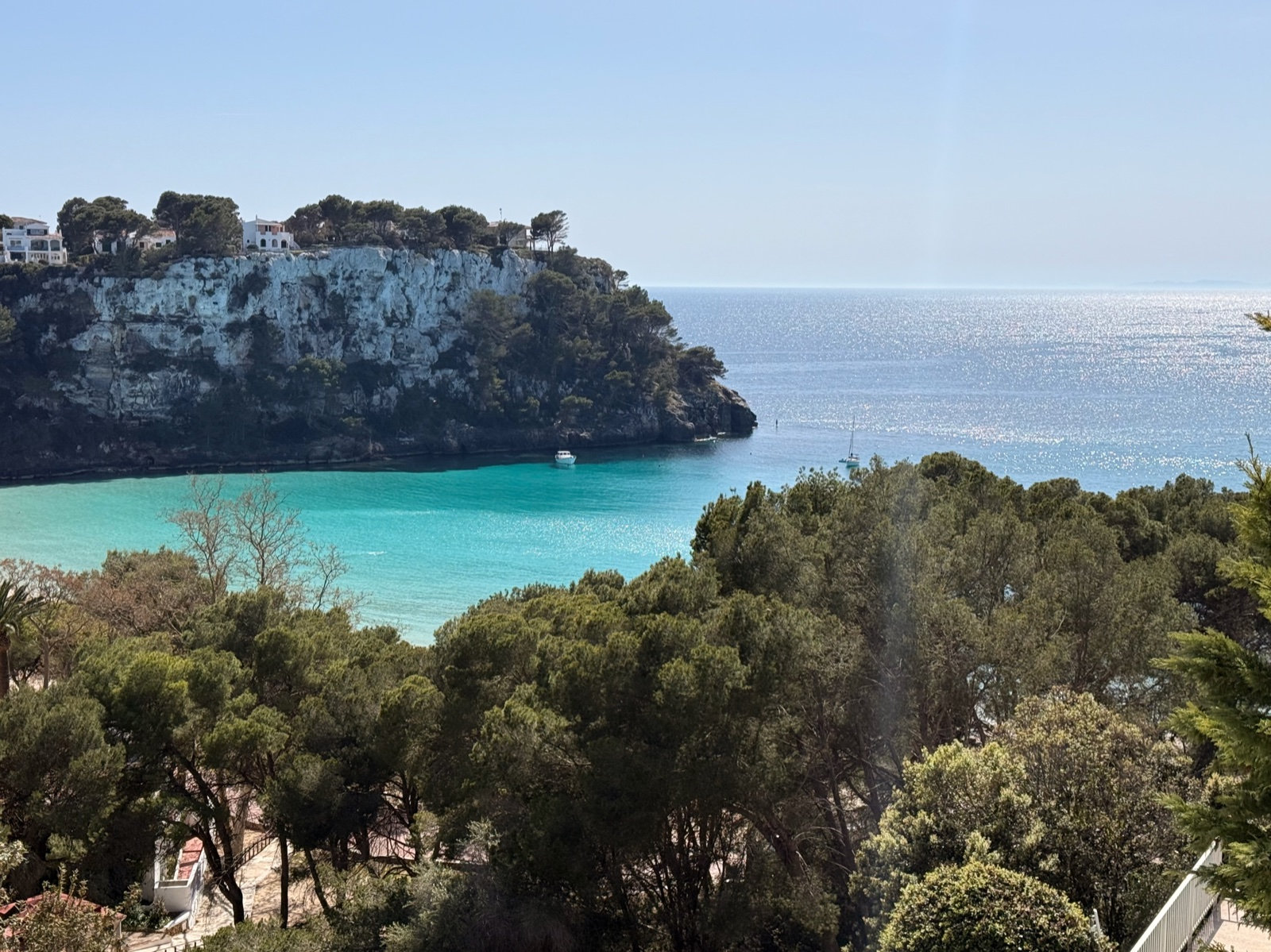 Cala Galdana bay with white limestone cliffs and deep turquoise water